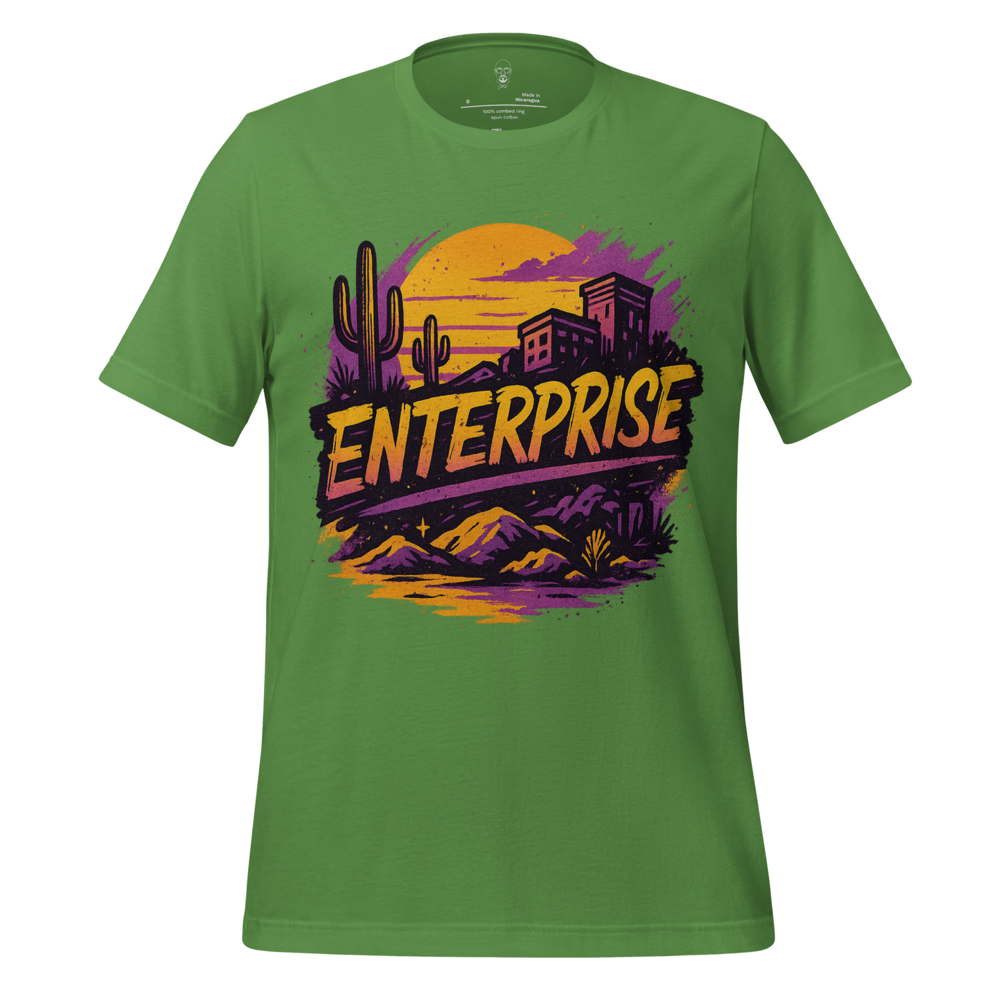 Green Enterprise Graphic T-Shirt by JMK Drip featuring desert landscape with cacti and buildings at sunset