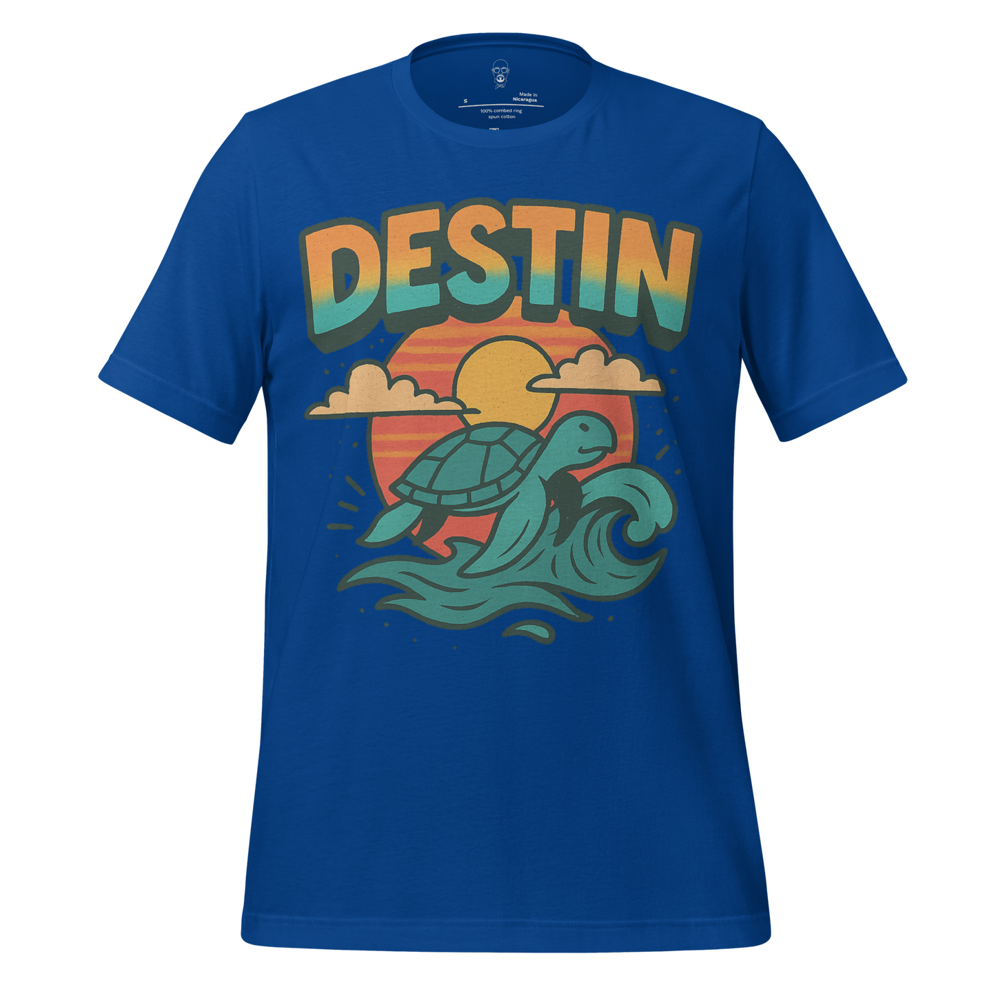Blue Destin Graphic T-Shirt featuring a sea turtle surfing waves against a sunset background