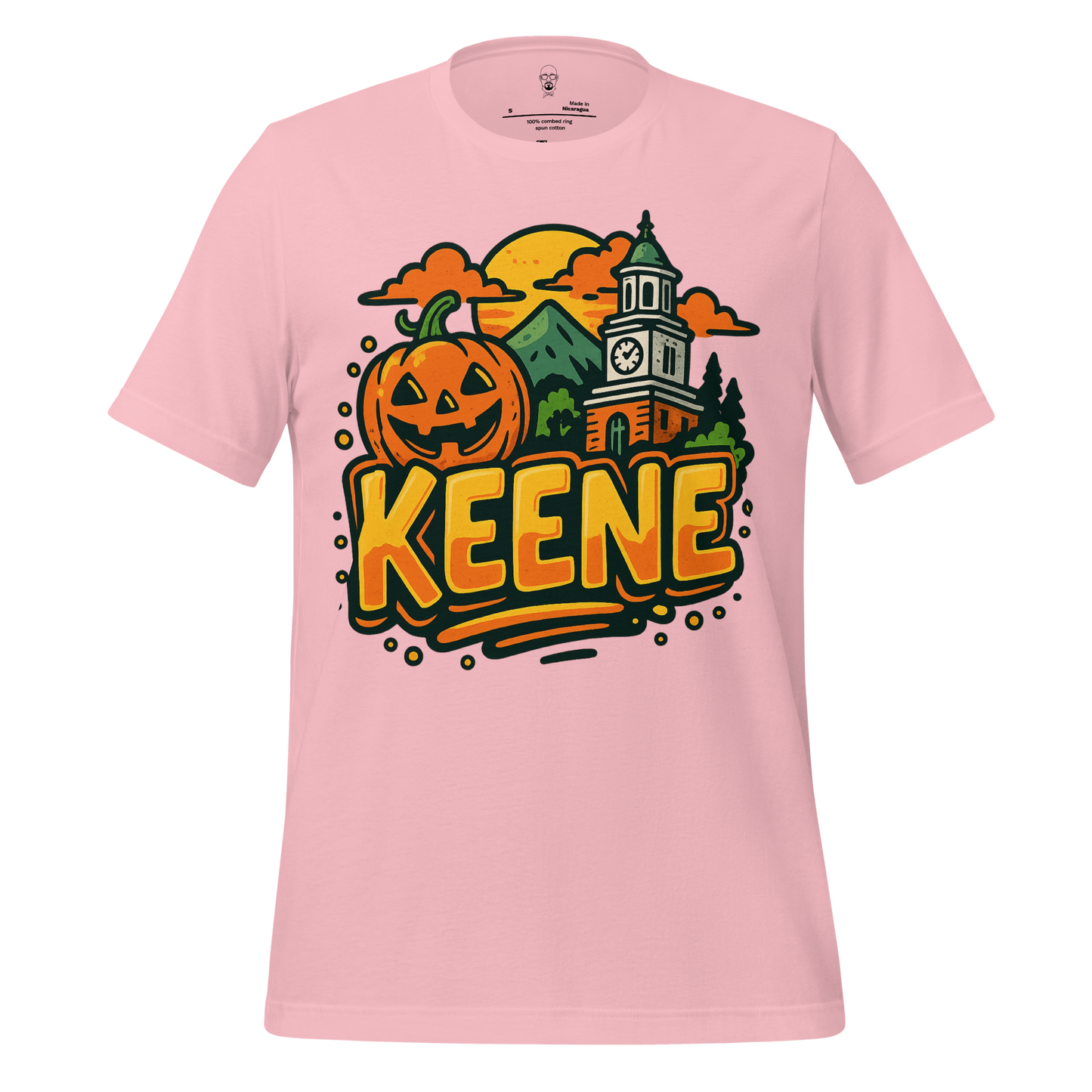 Pink Keene Graphic T-Shirt featuring a pumpkin, clock tower, mountains, and sunset design