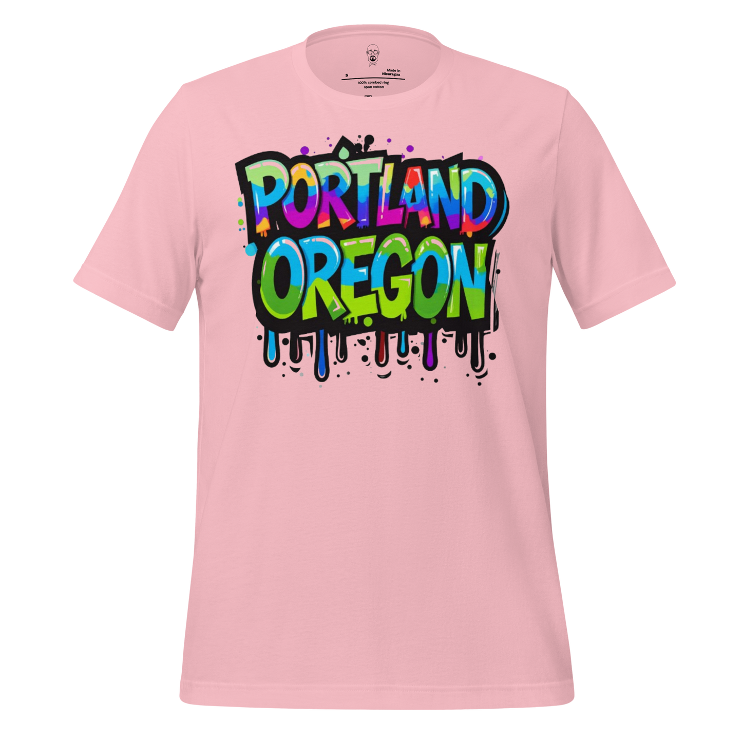 Pink t-shirt featuring colorful Portland Oregon graphic tee design with graffiti style lettering