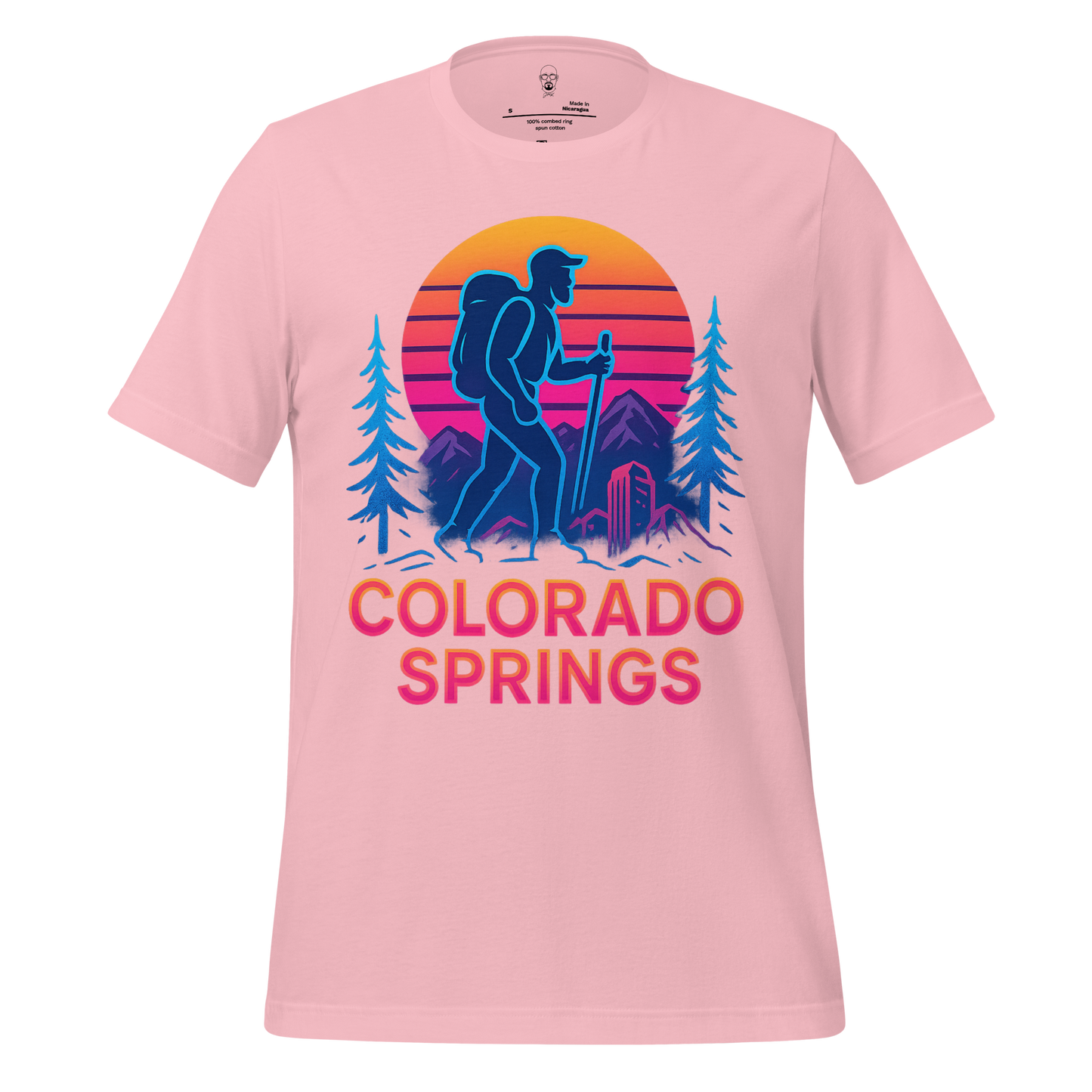 Pink Colorado Springs Graphic T-Shirt with hiking design and sunset mountain scenery by JMK Drip