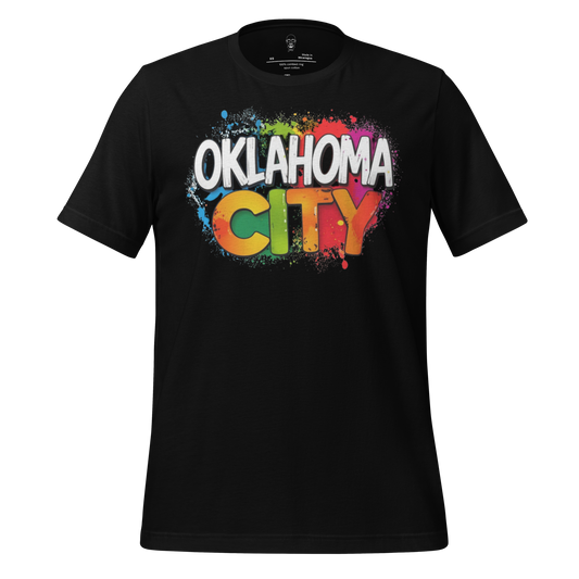 Black Oklahoma City t-shirt with colorful paint splatter design and bold white and orange lettering