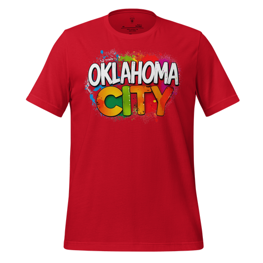 Red Oklahoma City t-shirt with colorful graffiti style text graphic on front by JMK Drip