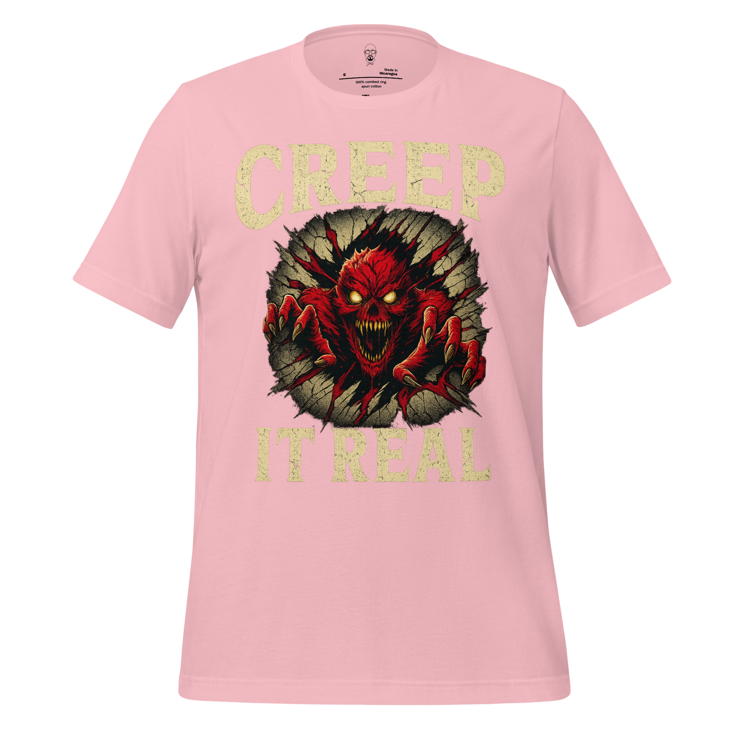 Pink creep it real t-shirt with red monster graphic breaking through wall design