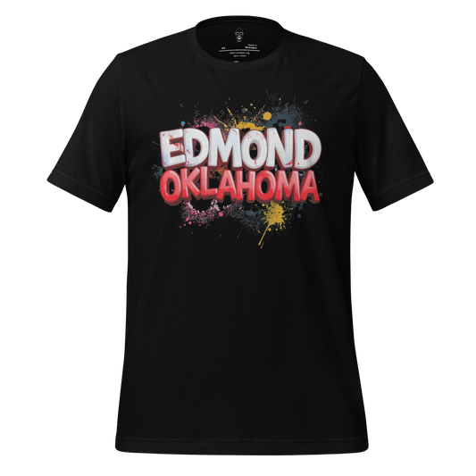 Black t-shirt with colorful paint splatter design and Edmond Oklahoma graphic tee text on front
