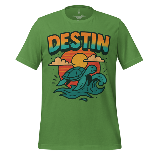 Green Destin Graphic T-Shirt featuring a turtle riding waves with a sunset background