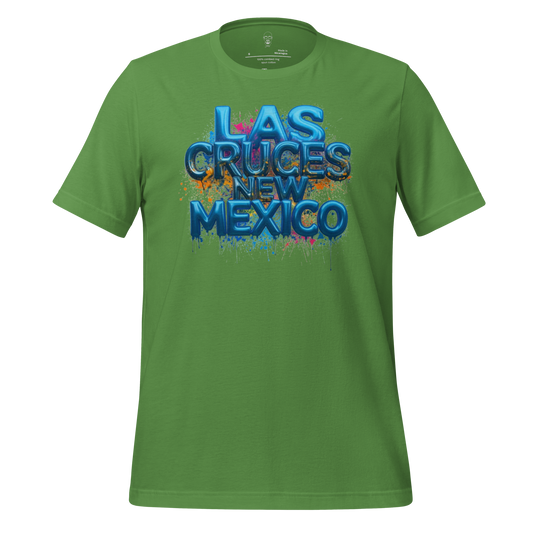 Green Las Cruces t-shirt with blue 3D text and colorful paint splatter design by JMK Drip