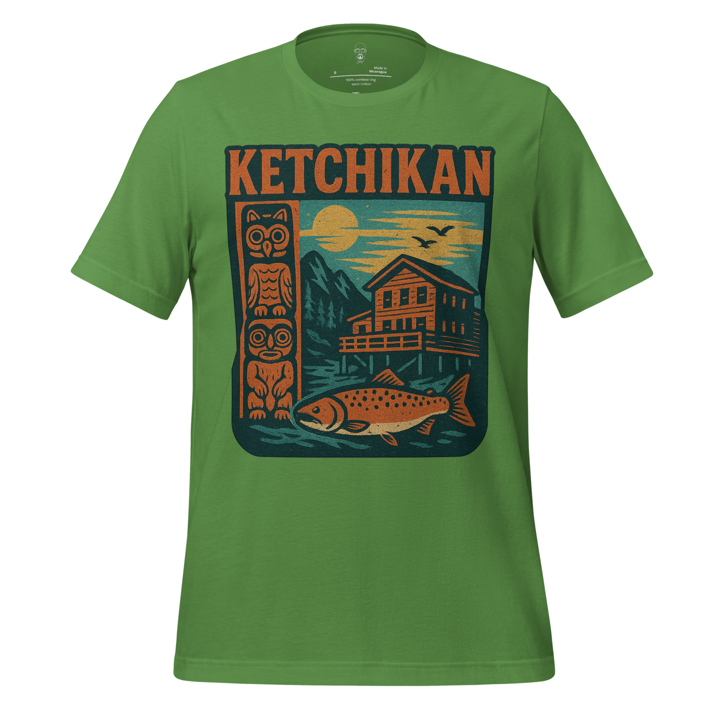 Green Ketchikan Graphic T-Shirt by JMK Drip featuring totem pole, cabin, fish, and sunset design