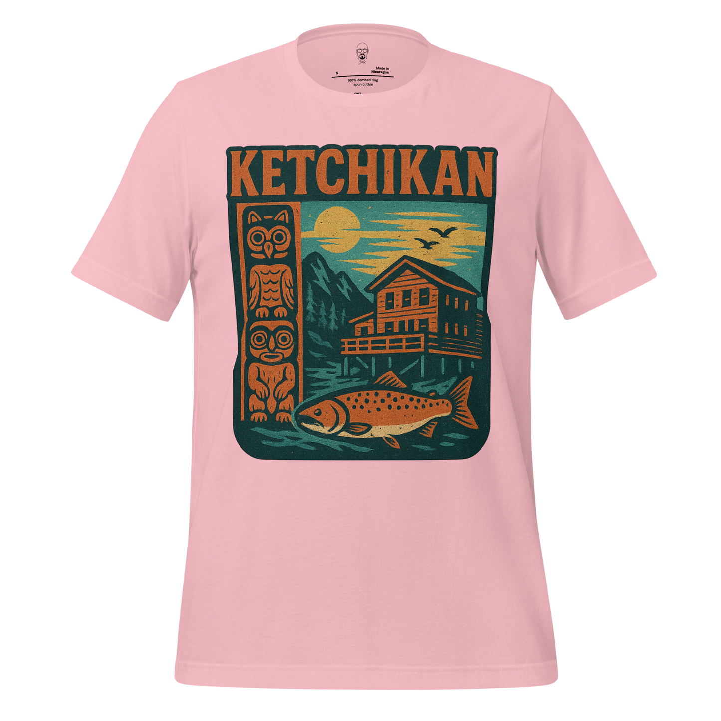Pink Ketchikan Graphic T-Shirt by JMK Drip featuring totem pole, fish, cabin, and mountain design
