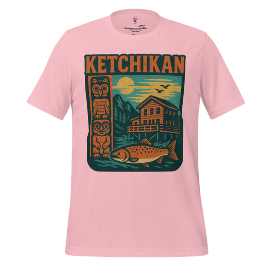 Pink Ketchikan Graphic T-Shirt by JMK Drip featuring totem pole, fish, cabin, and mountain design